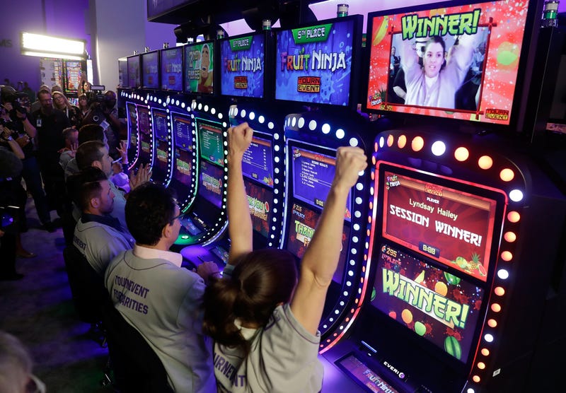 Conventioneers play at the Global Gaming Expo in Las Vegas