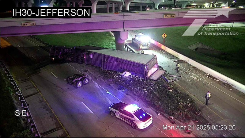 Overturned big rig closes eastbound I-30 in Downtown Dallas Monday