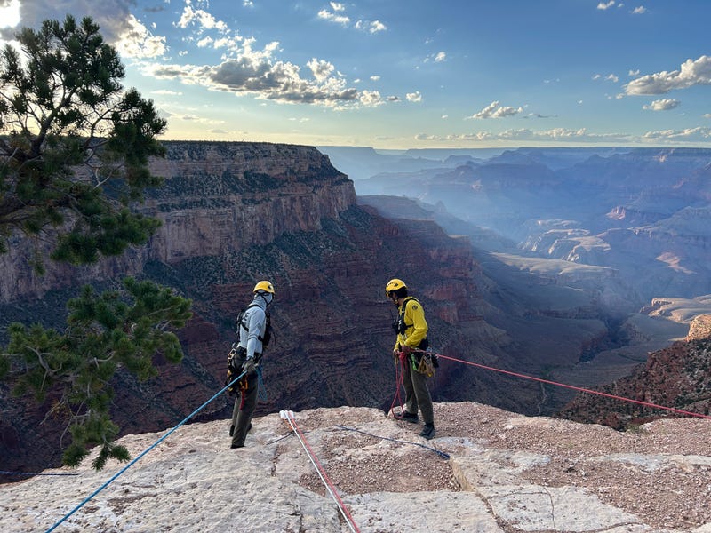 Search and rescue workers work to pull up a car at the Grand Canyon on 9-7-25.