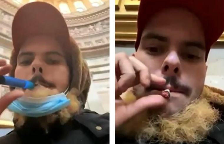 Greg Rubenacker, 26, of Farmingdale, New York, smoking in the Capitol Rotunda.