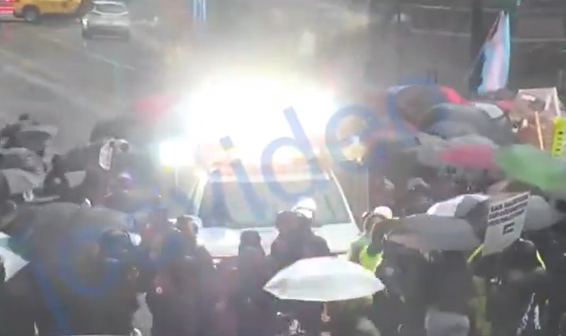 Demonstrators blocked police vehicles responding to a bomb threat in Times Square on Saturday afternoon. Eleven were arrested and charged with obstruction and disorderly conduct.