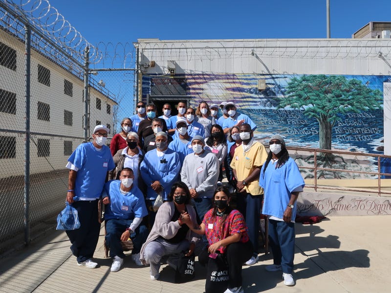 Crime victims and incarcerated men participating in the Ahimsa Collective's Empathize program pose for a picture at Soledad State Prison. 