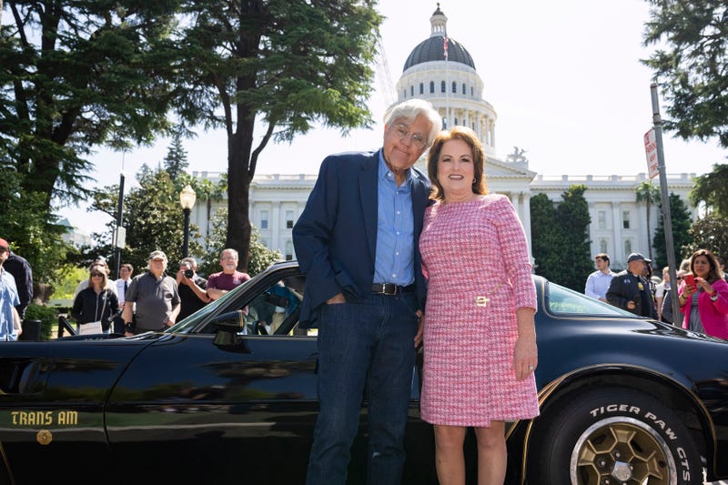 Jay Leno poses with California State Senator Shannon Grove in front of the California State Capitol as they presented "Leno's Law" to the Senate Transportation Committee on April 8, 2025.