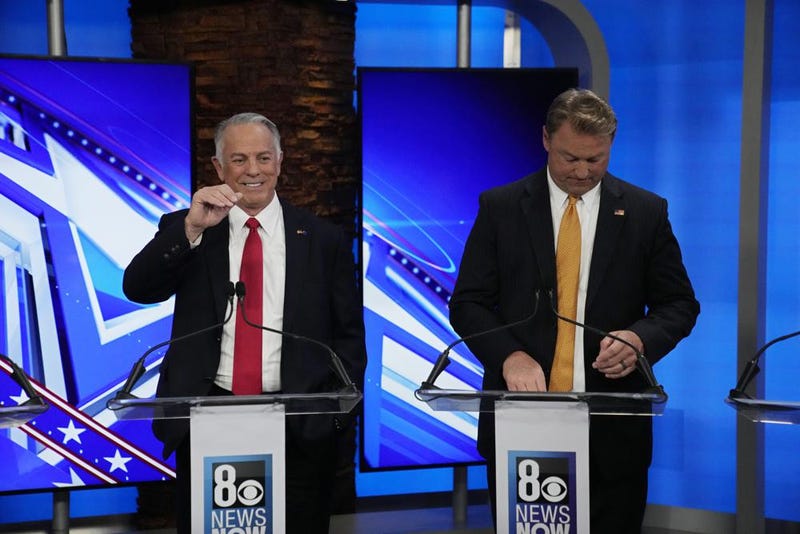 Joe Lombad and Dean Heller debate during an event in Las Vegas on May 25th, 2022