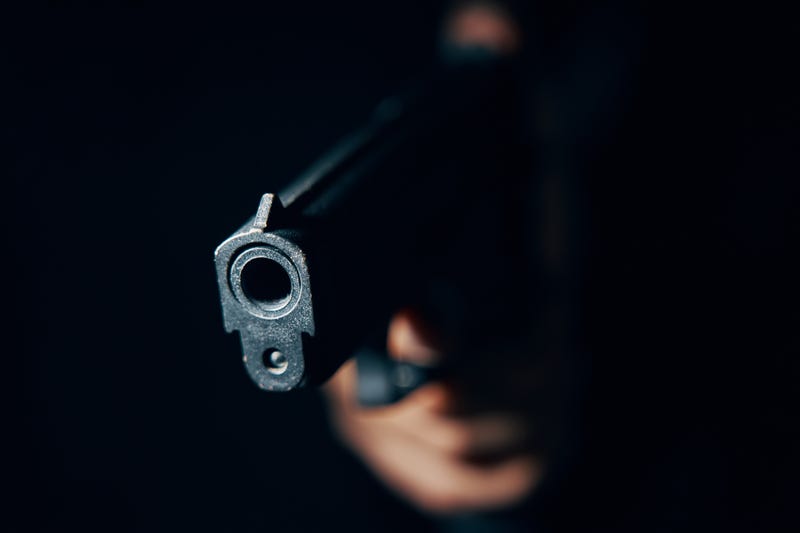 Gun pointed at camera in close-up