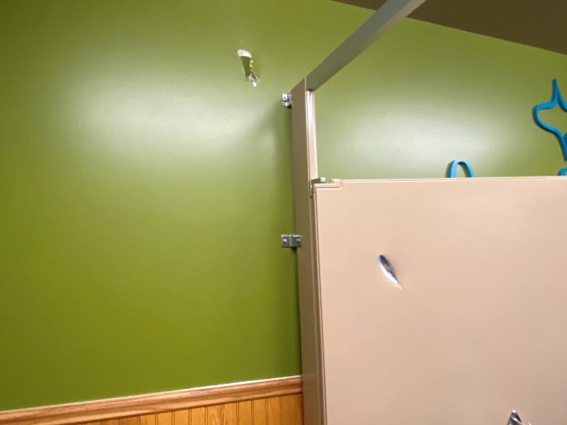 Bullet hole in the Flap Jack Shack bathroom