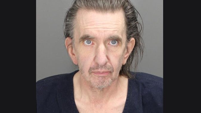 Oakland County man charged after living with dead body in his bathroom for a month