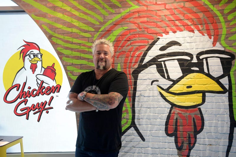 Guy Fieri in front of Chicken Guy! mural