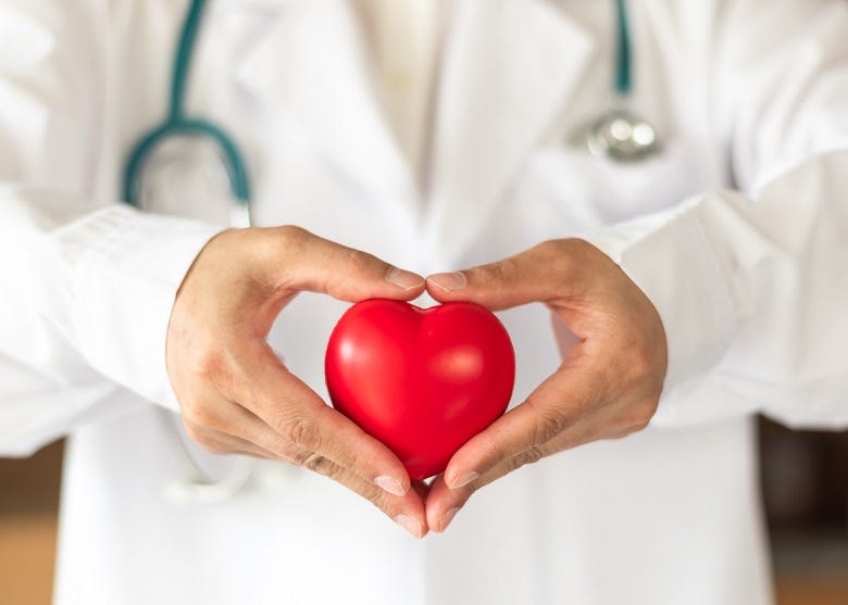 Doctor holding heart