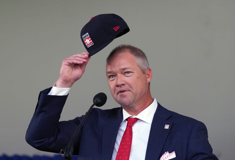 Former Cardinals third baseman Scott Rolen tips his cap to his parents after giving his Baseball Hall of Fame induction speech