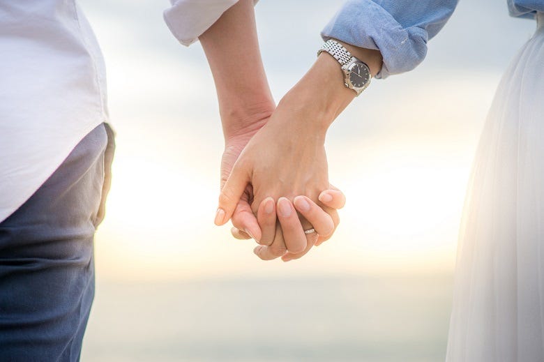 couple holding hands