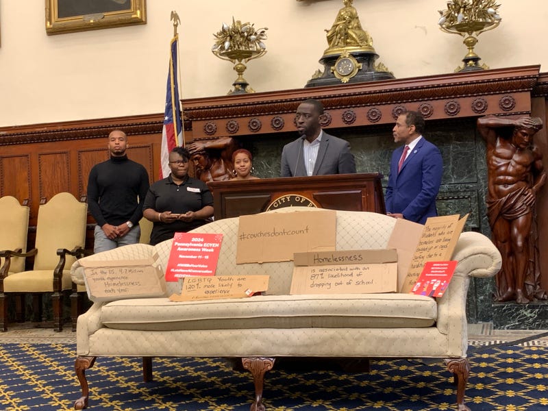 Councilmember Isaiah Thomas stands in front of a couch in the Mayor's Reception Room on Tuesday.