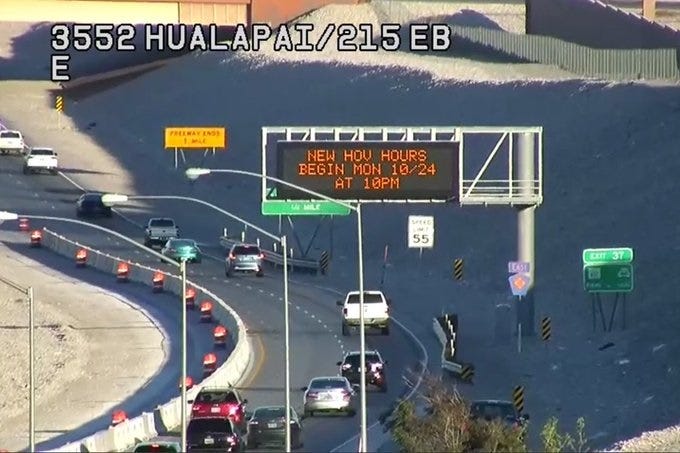 Overhead sign informs drivers of upcoming changes to HOV lane hours