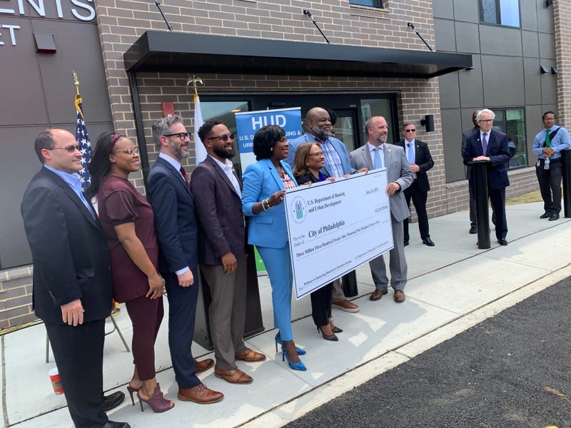 Mayor Cherelle Parker poses with the $3.3 million check with Acting Secretary of HUD Adrianne Todman.