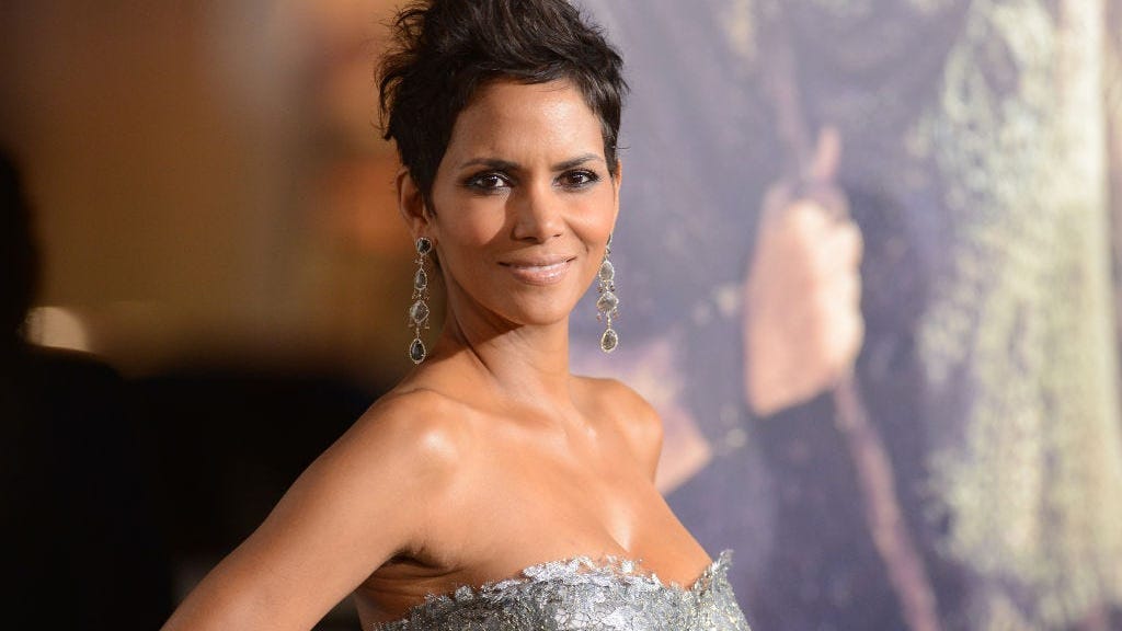 Halle Berry poses in bikini bottoms snuggled up next to boyfriend Van Hunt