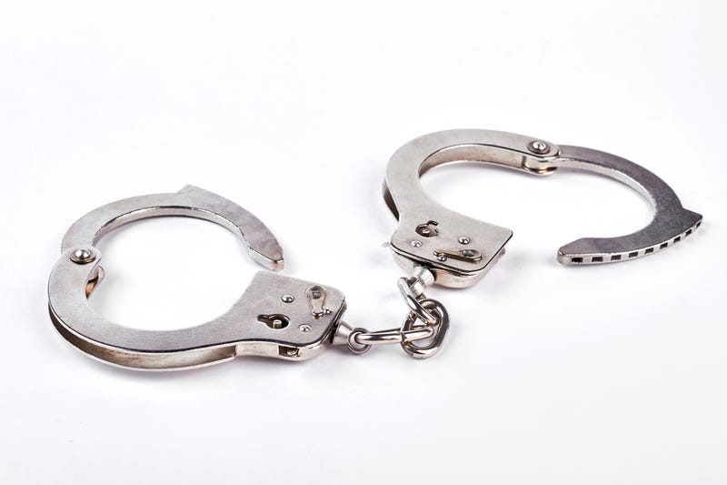 A pair of unlocked handcuffs