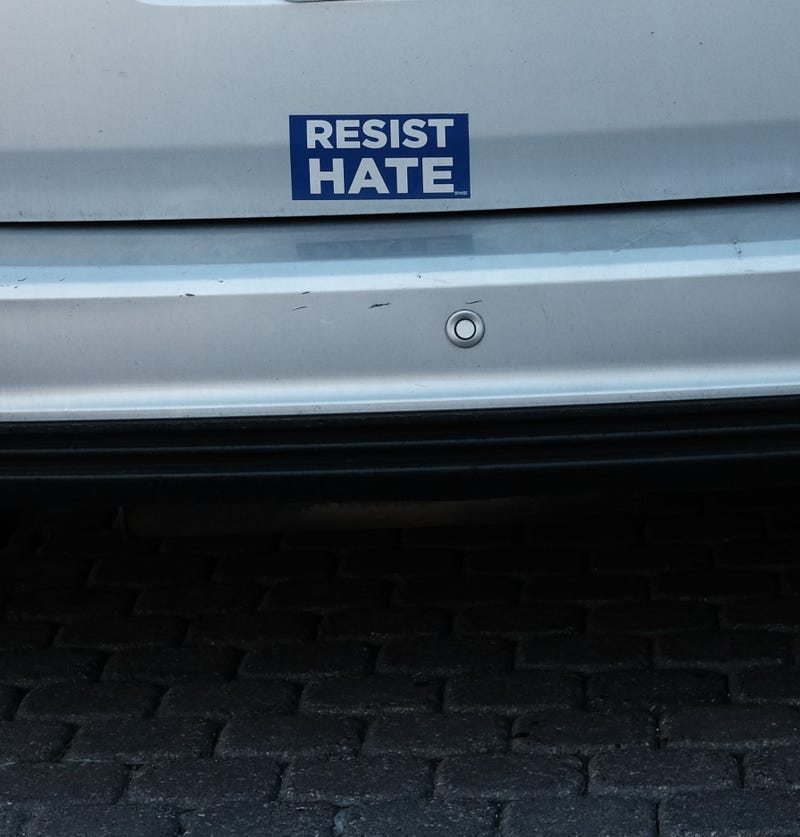 A bumper sticker urges drivers to resist hate