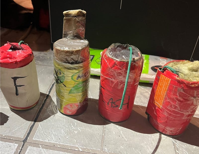 aMultiple live IEDs were recovered from the apartment, authorities said