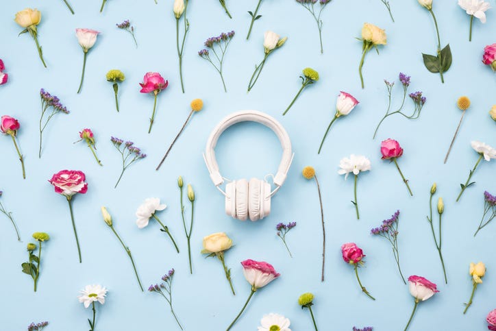 Headphones surrounded by flowers