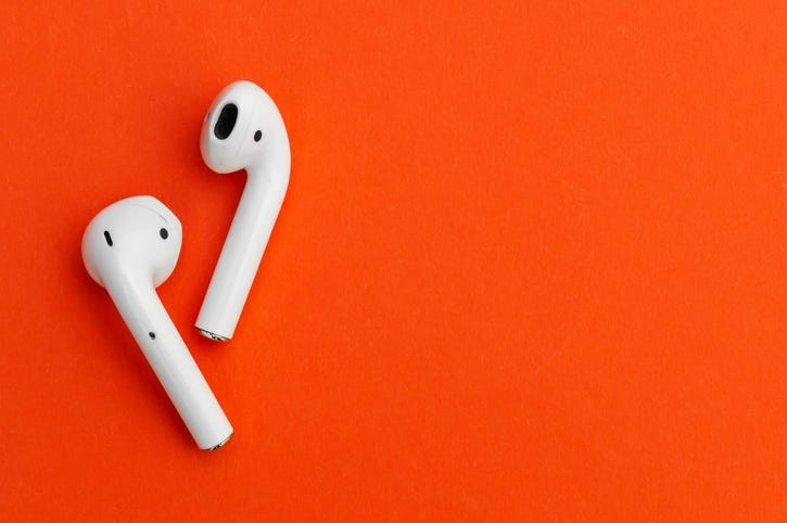 headphones on an orange background