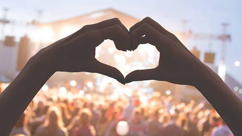 heart hands from fan in concert crowd