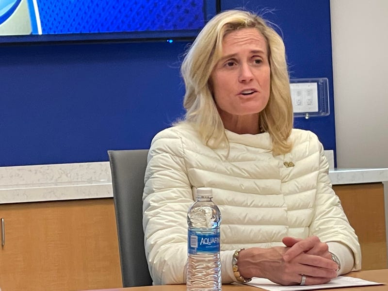 Heather Lyke talking at a table