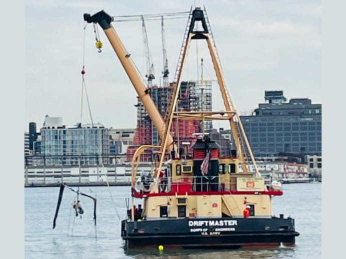 ​​Photo of the main rotor of the Bell 206 L-4 helicopter that crashed into Hudson River on April 10 near Jersey City, New Jersey being recovered by the United States Army Corps of Engineers.