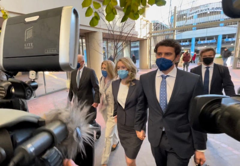 Elizabeth Holmes walking into the courthouse with her partner, Billy Evans.
