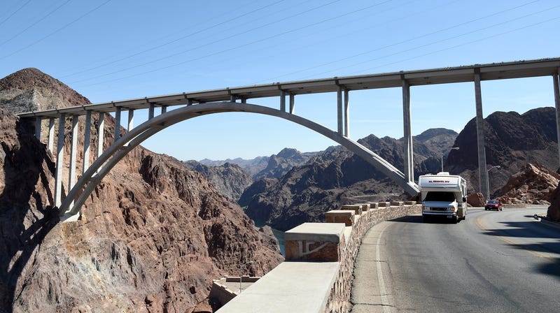 : Vehicles drive under the Mike O'Callaghan-Pat Tillman Memorial Bridge part of the Hoover Dam Bypass on July 17, 2014