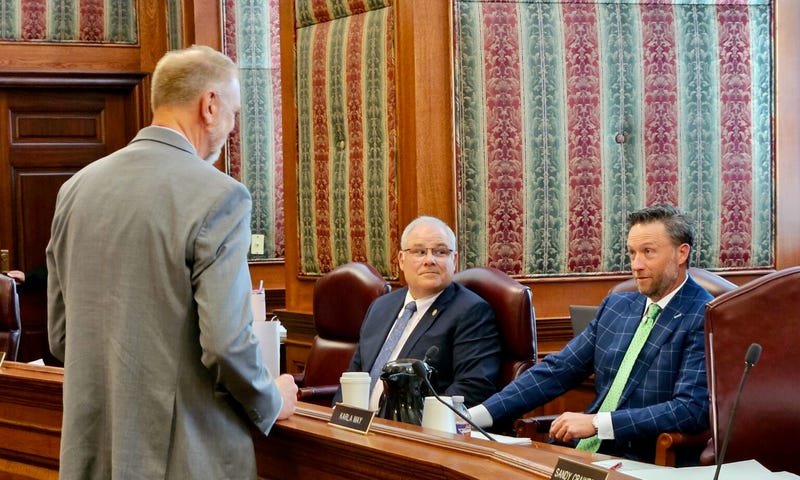 Missouri Senate Appropriations Committee Chairman Lincoln Hough, right, and Vice Chairman Rusty Black speak with state budget director Dan Haug April 16 during a break in committee work