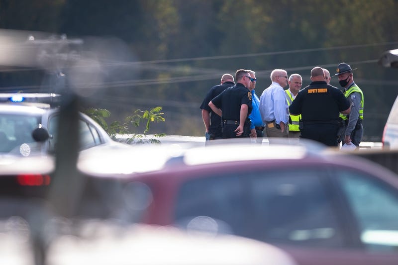 Police officers at the scene of an accident on I-85 north in which which injured four people, including two GCSO deputies, and killed Sgt. Conley Jumper on Tuesday, October 20, 2020. 