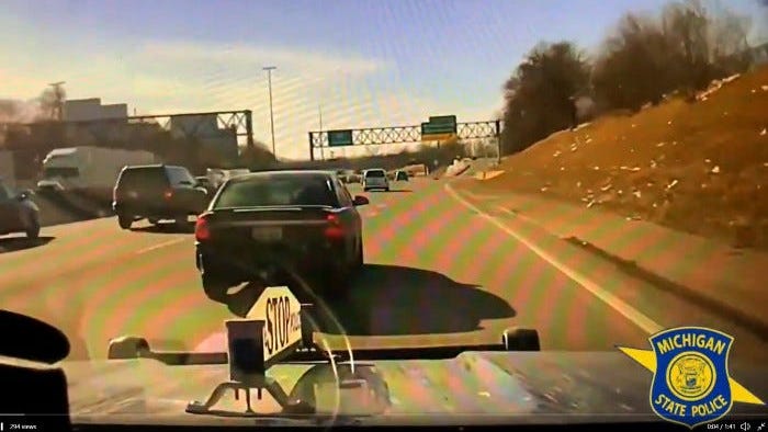Man faces fleeing, domestic violence charges after woman calls 911 from his car on I-96