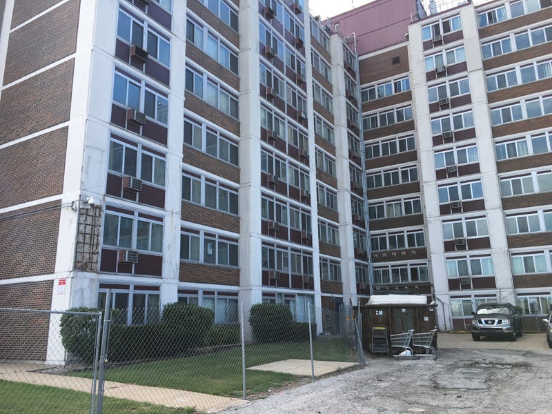 The John Nicosia Senior Building, located on Railroad Avenue, has crumbling concrete support columns, with visible rusted rebar.