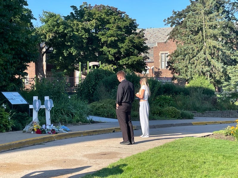 Mourners at a makeshift memorial outside Minneapolis' Annunciation Catholic Church on Thursday.