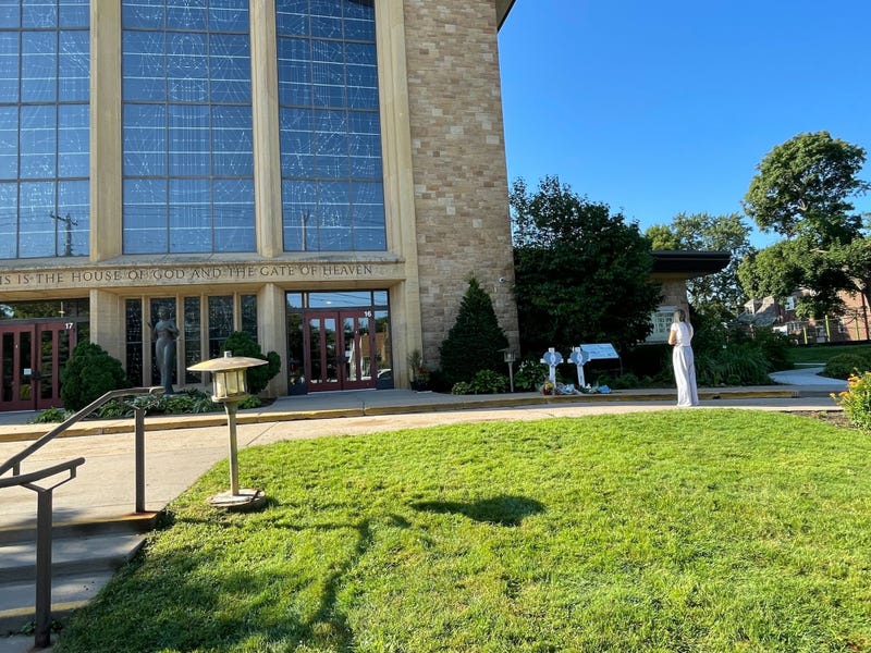 The early morning scene outside Annunciation Church on Thursday, a day after a gunman killed two and injured several others during a Catholic Mass.