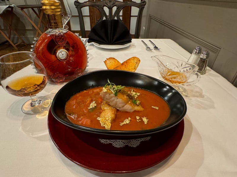 bowl of soup with gold leaf