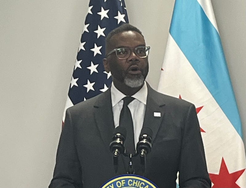 Chicago mayor Brandon Johnson speaks to reporters at City Hall.