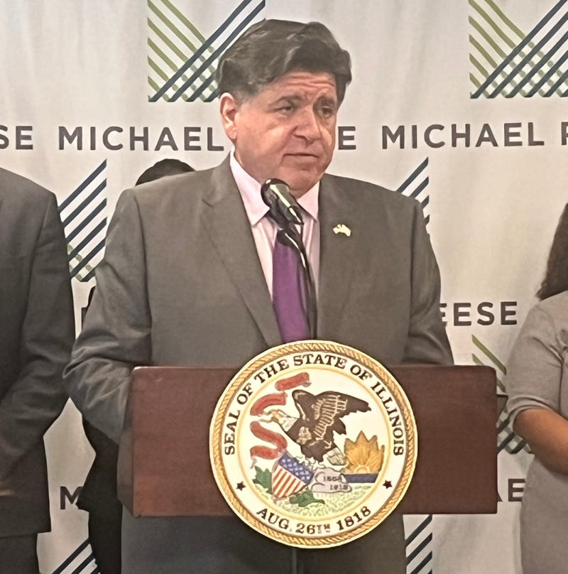 Illinois Gov. J.B. Pritzker answers reporters' questions during an event at the Michael Reese Health Trust in the Loop. 