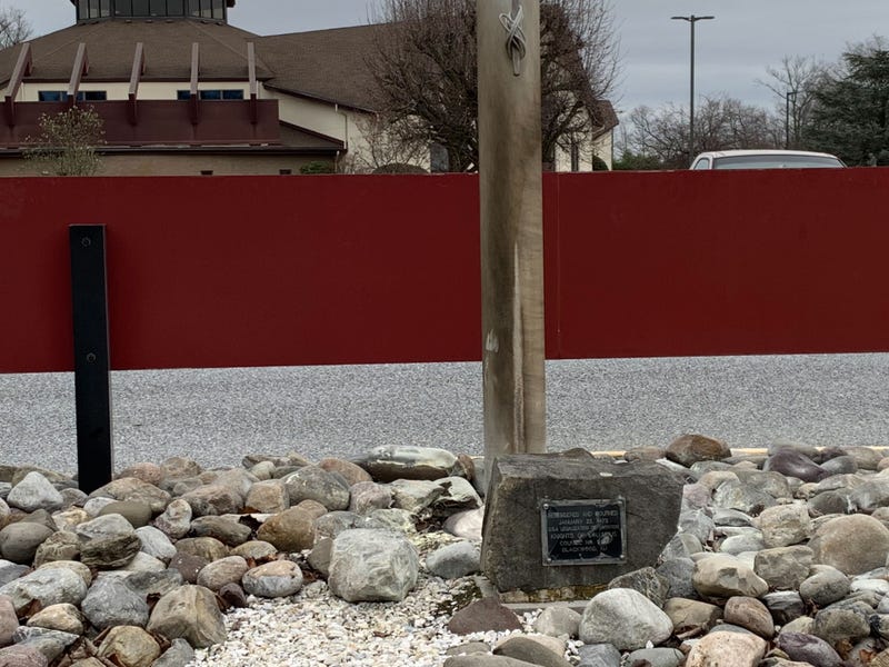 A burned flagpole behind the parish center sign at Our Lady of Hope - Saint Agnes Church in Gloucester Township. Authorities accuse Peter Sirolli, 40 of Deptford, of lighting the flagpole and causing damage to other Catholic churches across South Jersey on Friday.