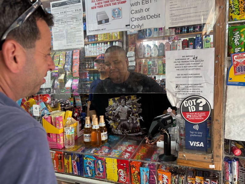 Four men wearing NYPD gear stormed into Tajuken Deli Grocery in Bedford-Stuyvesant last week, flashing guns and threatening employees and customers.