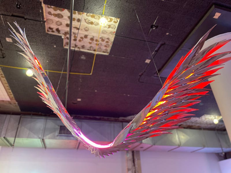 Neon wings hang from the ceiling at the Neon and Light Museum