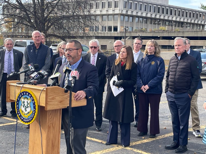 CT House Majority Leader Jason Rojas (D-New Haven) speaks at a news conference in East Hartford about the state's new housing bill, 11/7/25. Gov. Ned Lamont (D) stands at right.