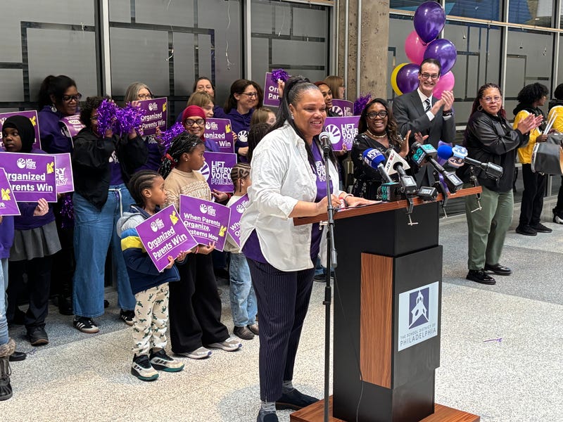 Jamila Carter stands at a podium, saying how Philadelphia teachers can no longer withhold recess or bathroom breaks as discipline