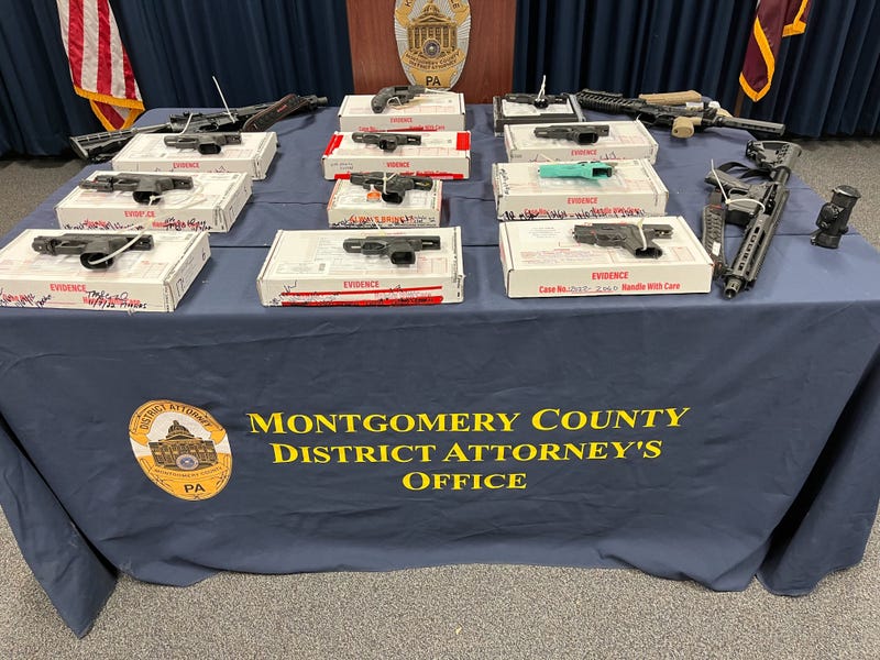 Guns which prosecutors say were seized in the breakup of a gun-trafficking ring that illegally bought and sold 94 firearms across Southeastern Pennsylvania.