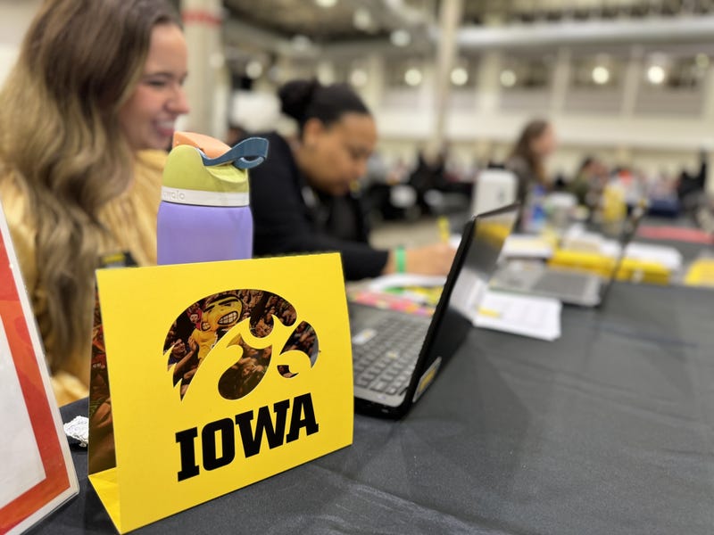 Iowa Hawkeyes sign at table