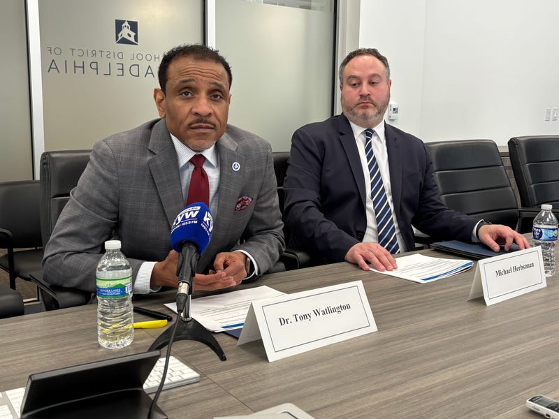 Superintendent Tony Watlington (left) and Philadelphia School District CFO Mike Herbstman brief reporters on plans to slash millions in spending to balance next year's budget.