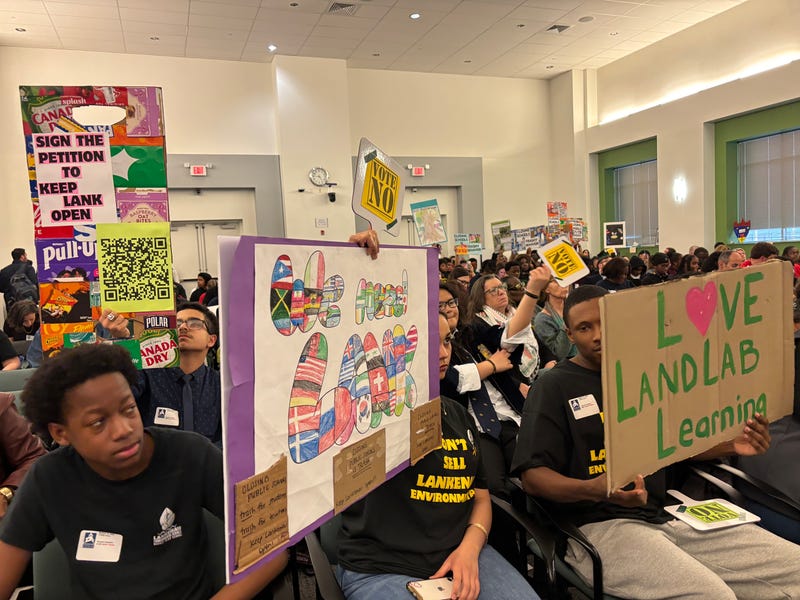 Students hold signs at a packed Philadelphia School Board meeting Thursday night, March 12, 2026.