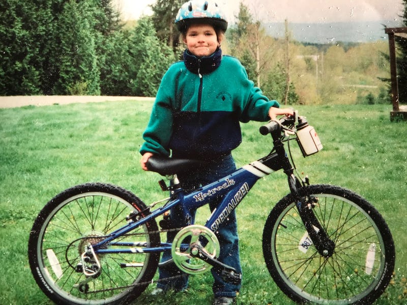 Wilson with a bicycle as a young girl.