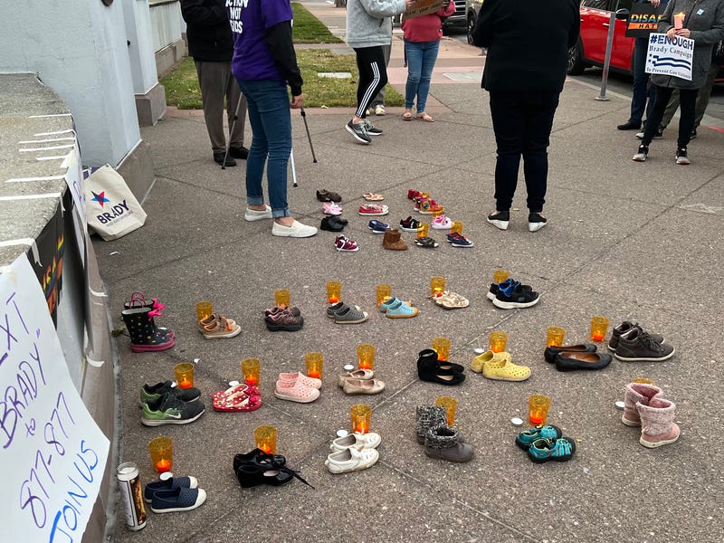 The vigil featured 19 pairs of shoes, with candles next to them, representing the 19 children killed in the mass shooting in Uvaldi, Texas this week.