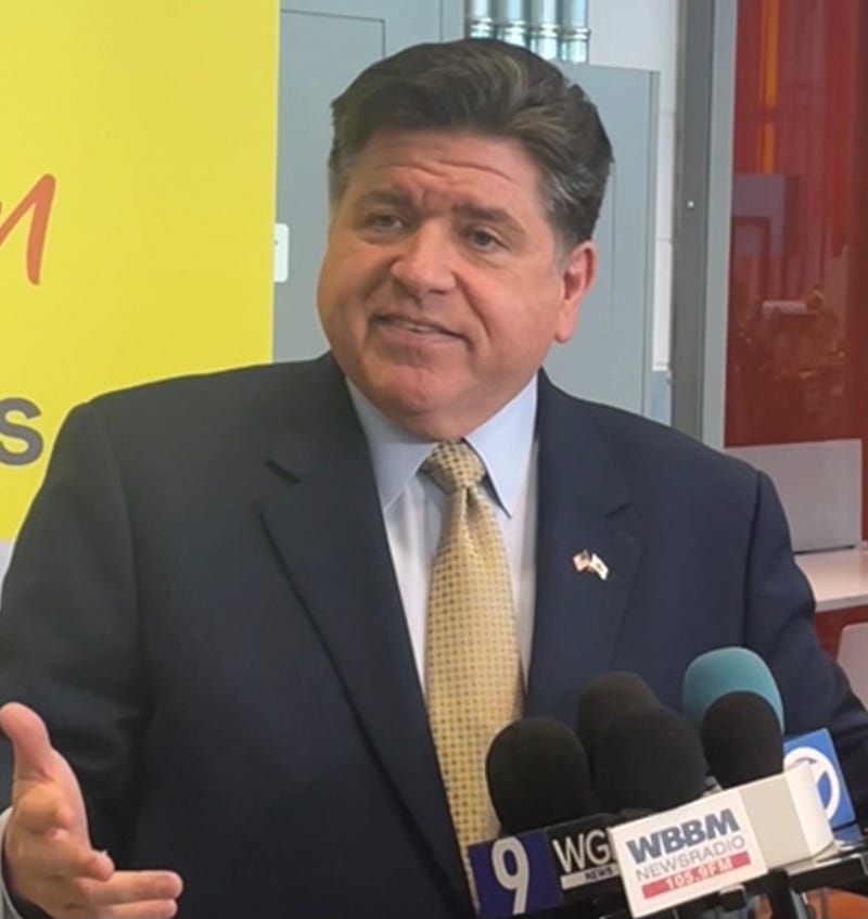 Illinois Gov. J.B. Pritzker answers reporters' questions during an appearance at Richard J. Daley College. 